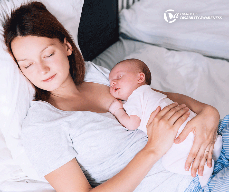 Mother holding a baby.