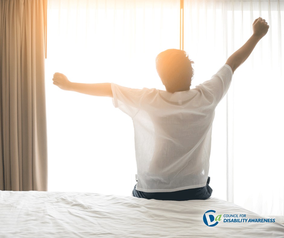 Man waking up in bed.