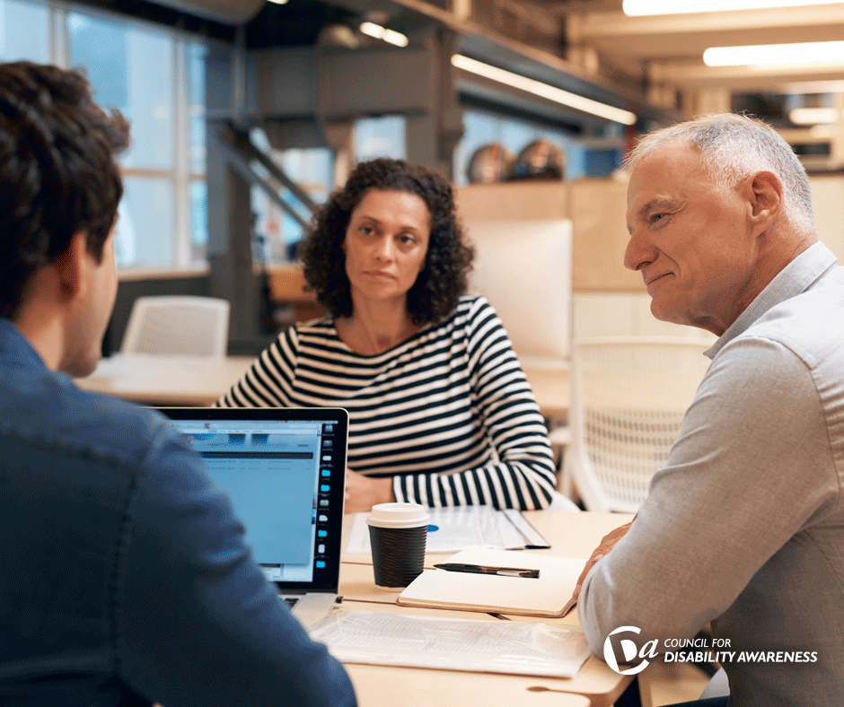 Meeting with workers at a desk