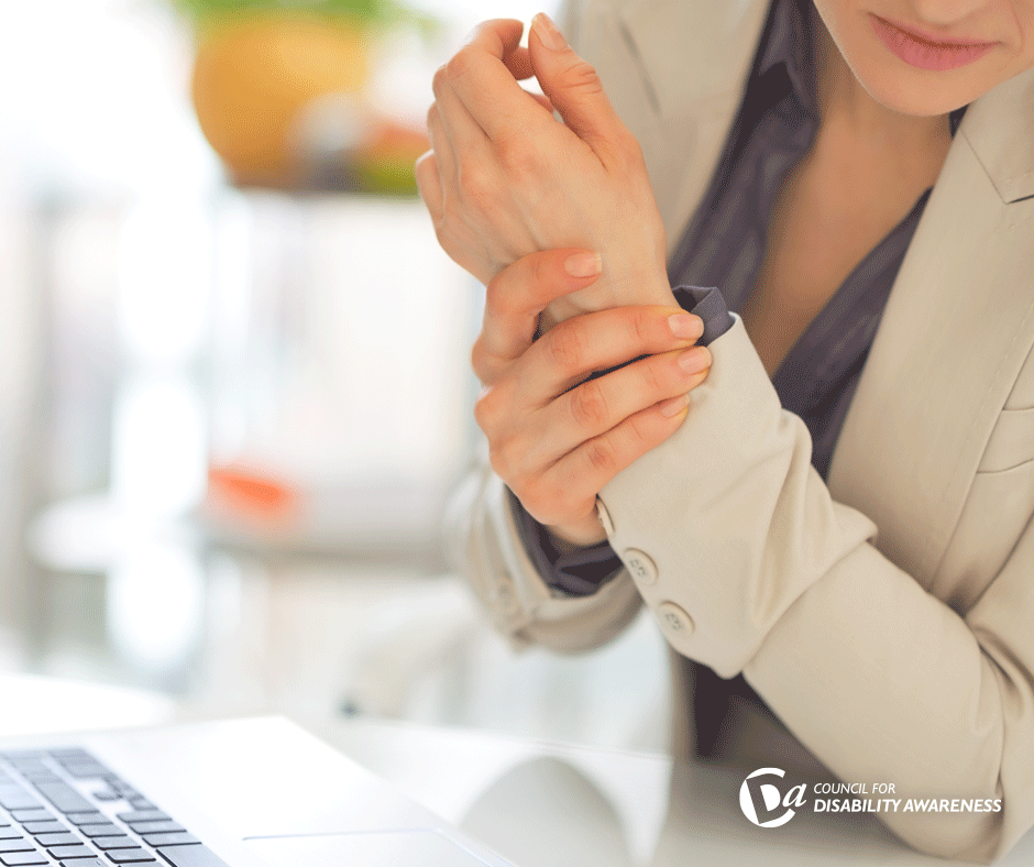 Woman holding her wrist.