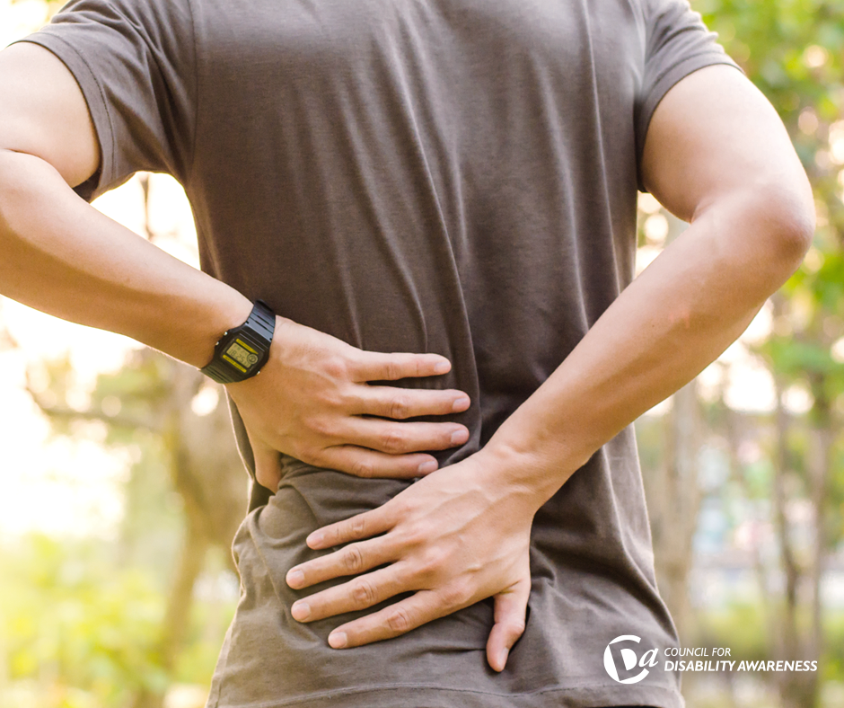 Man holding his back