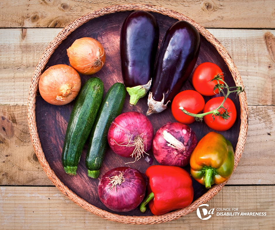 Bowl of vegetables on a wooden table.
