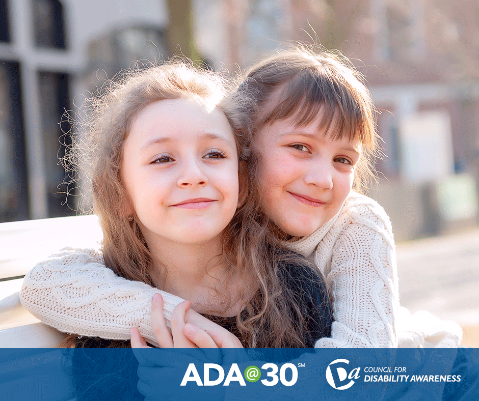 portrait of two young girls hugging