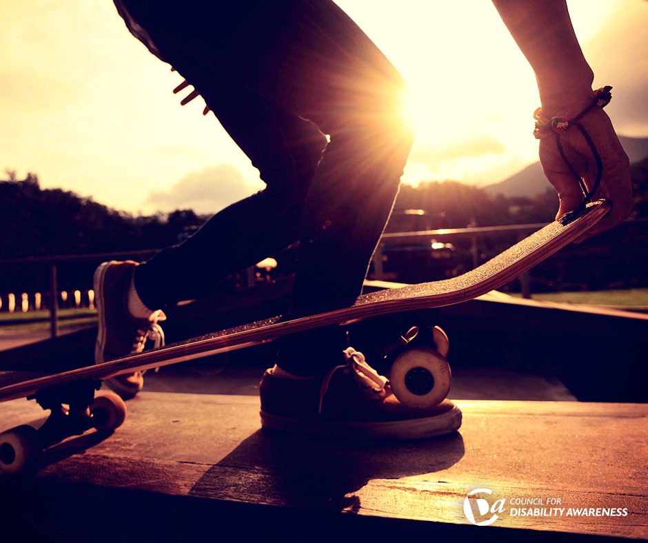 Skateboarder's feet at sunset