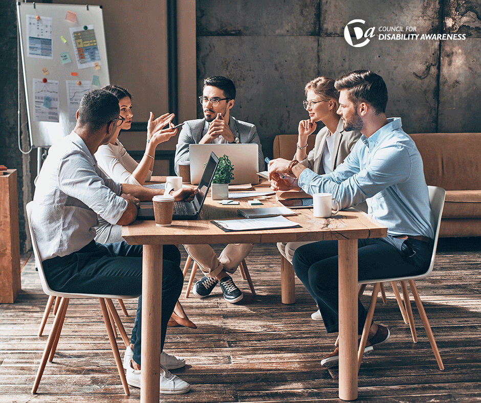 Group of diverse young professionals meet in conference room