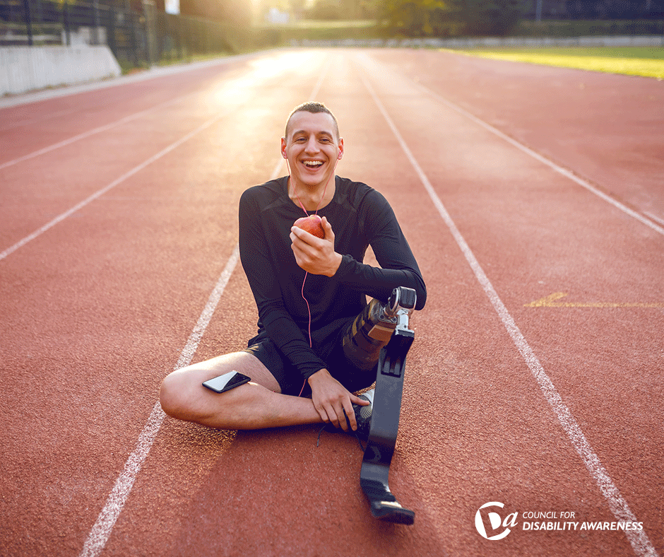 Athlete with a disability takes a break on the track