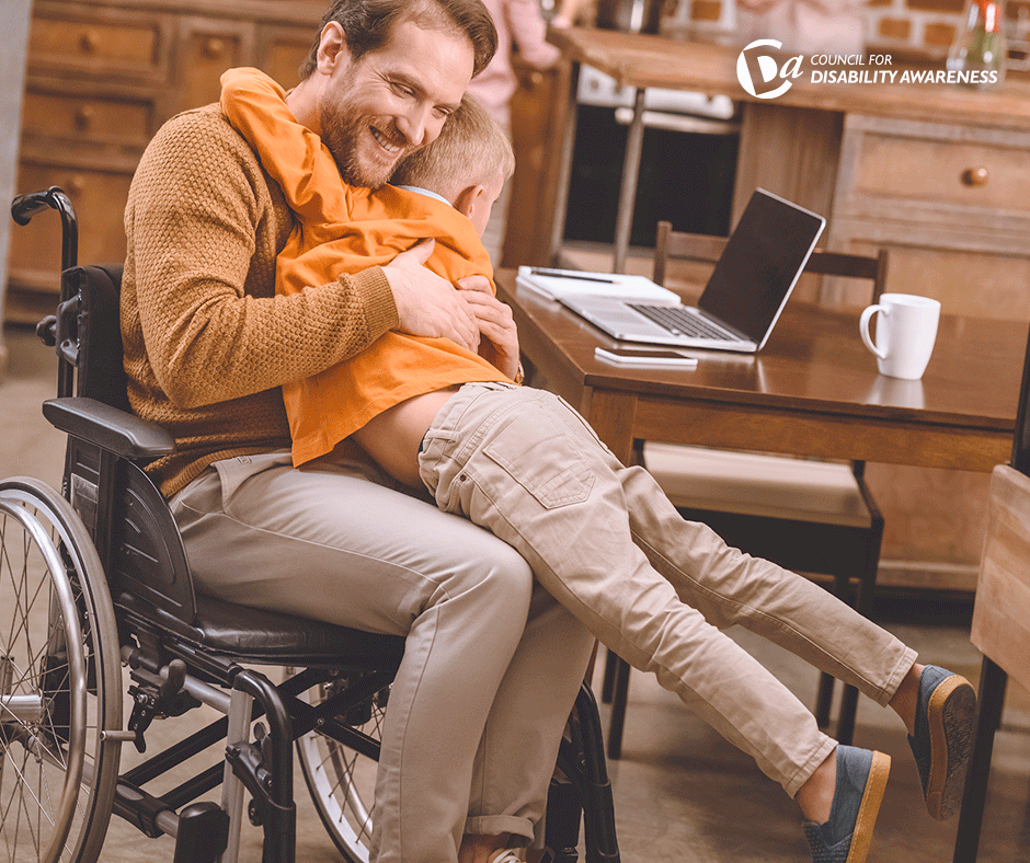 Father in a wheelchair with a disability hugs his son