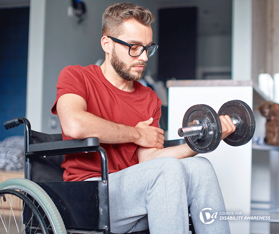 young man in wheelchair exercises with dumbbell weight