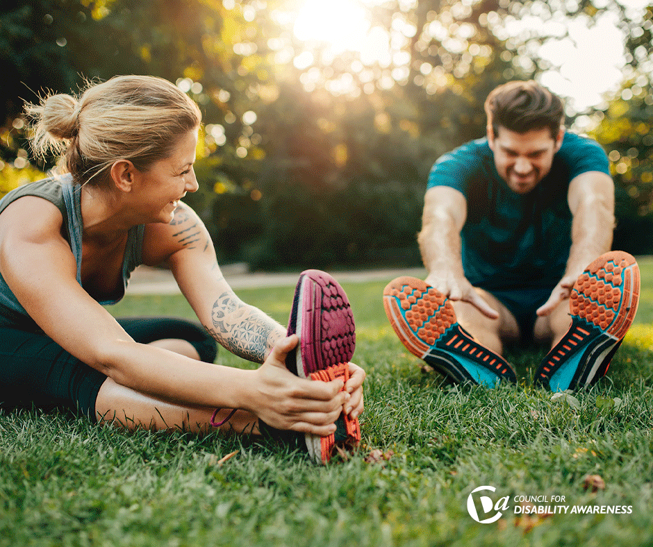 Young couple stretching in the park after a run