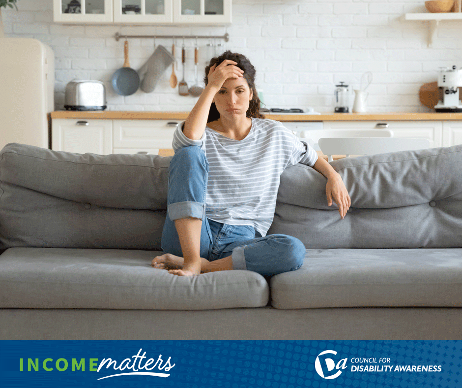 Young woman at home struggling with her mental health. Income Matters.