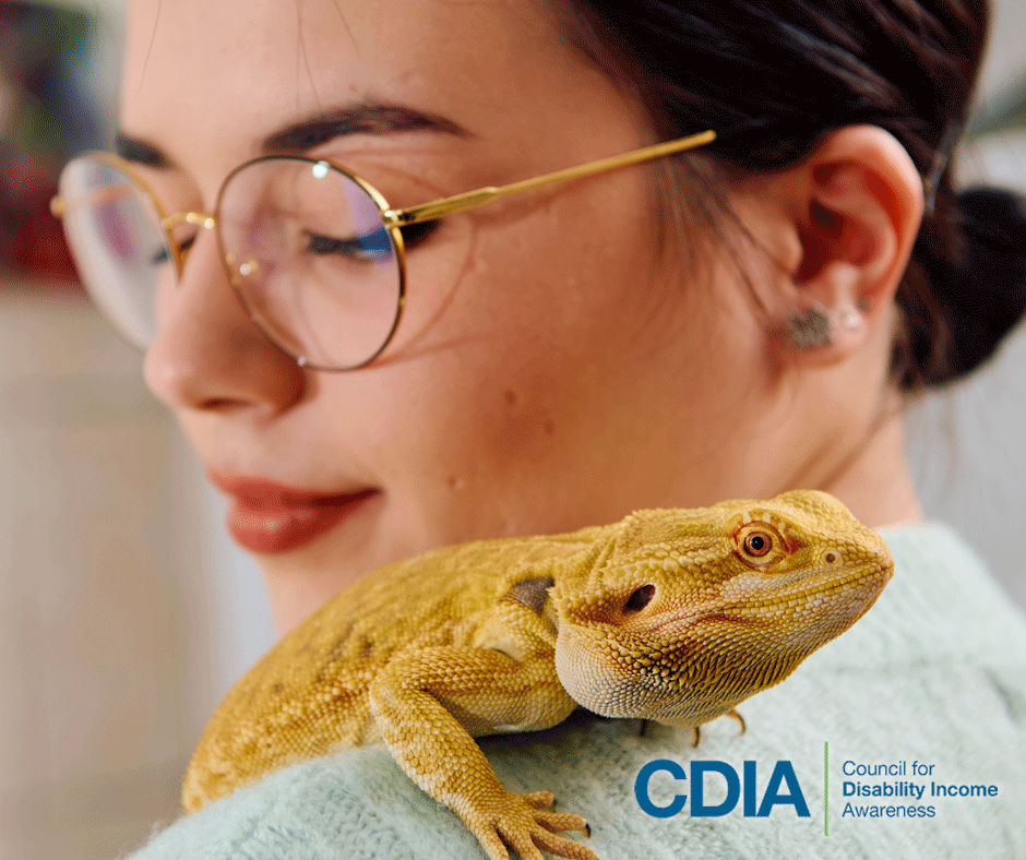 Young woman with her pet bearded dragon