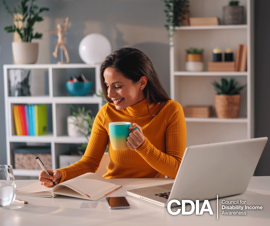 Professional woman with laptop in home office