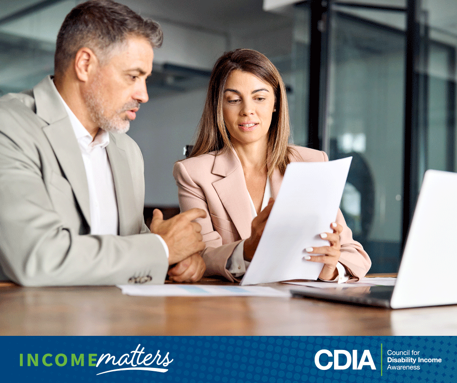 Income Matters, CDIA. Professional man reviewing his employer's group health plan