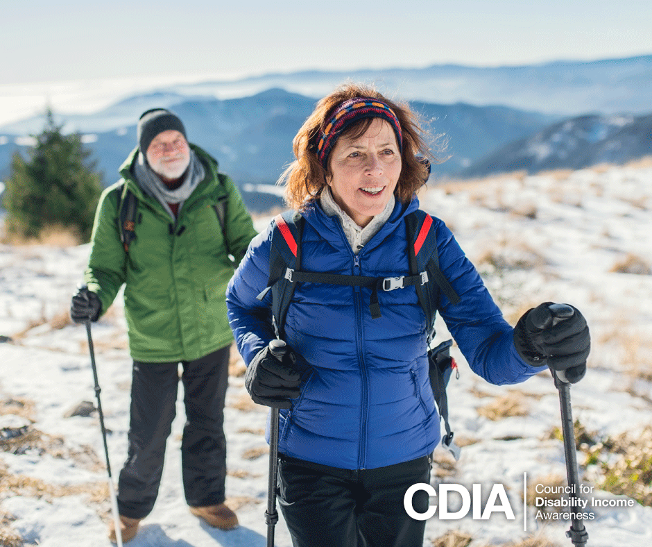 Mature couple hiking outdoors in winter