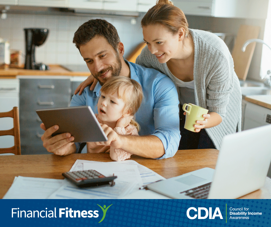 Working couple reviews their finances at the kitchen table. CDIA Financial Fitness Campaign.