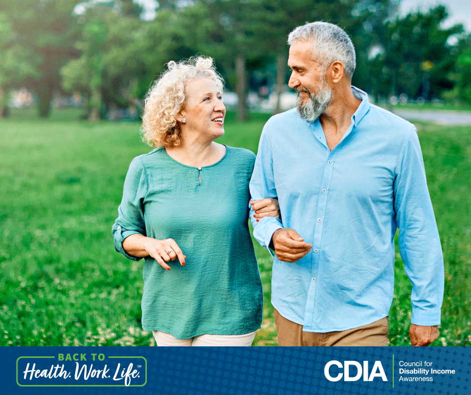 Couple walking together outside. Back to Health. Work. Life. The CDIA